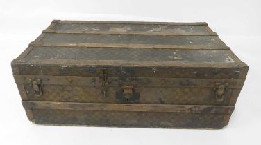 An early 20th century Louis Vuitton travelling trunk, canvas, wood and metal bound, having twin