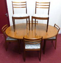 A 1960s G-Plan 'Fresco' teak dining suite, comprising; D-end dining table with pull-out action and