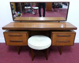 A 1960s G-Plan 'Fresco' teak long mirrorback kneehole dressing table, having central frieze