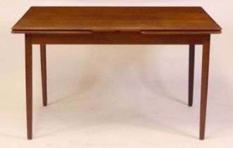 A 1960s Danish teak draw-leaf dining table, raised on turned slightly tapering supports, h.70cm, max