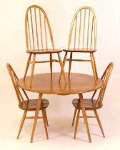 A 1960s Ercol blond elm breakfast suite, comprising; drop flap table raised on square tapering