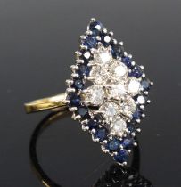 An 18ct yellow and white gold, sapphire and diamond navette shaped cluster ring, comprising a centre