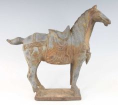A large hollow cast model of a Tang horse, in standing pose and livery on a rectangular plinth, Tang
