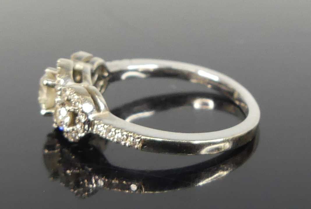 An 18ct white gold diamond triple cluster ring, featuring three graduated round brilliant cut - Image 4 of 5