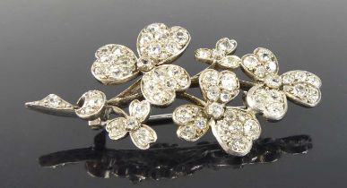A white metal diamond shamrock style spray brooch, featuring 78 Old European and rose cut diamonds