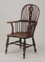 A Victorian elm seat, ash and fruitwood Windsor chair, having a pierced vase splat and comb back (