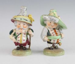 Two Royal Crown Derby Mansion House dwarves, each shown in 18th century dress, their hats with