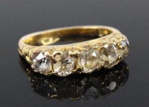 A yellow metal late Victorian diamond half hoop eternity ring, comprising five graduated old cushion