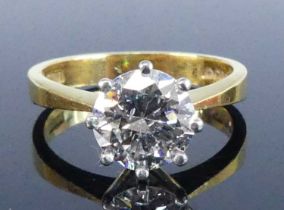 A 22ct yellow gold diamond solitaire ring, featuring a round brilliant cut diamond in a white