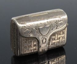 An early Victorian silver vinaigrette in the form of a satchel / handbag, having all-over bright cut