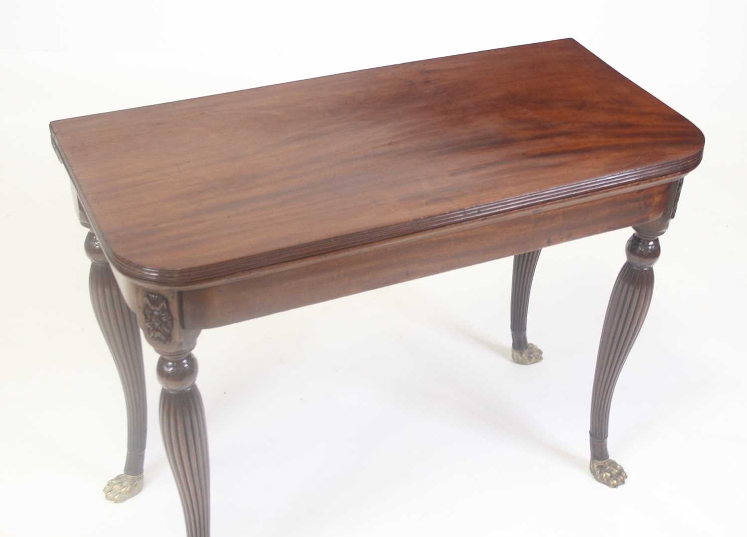 A George III Irish mahogany card table, the D-shaped fold-over top having a reeded edge and on - Image 2 of 12