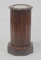 A Victorian mahogany and marble topped cylindrical pot cupboard, of fluted form with hinged door