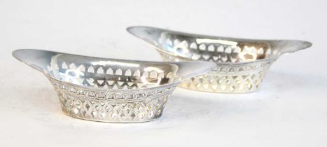 A pair of Victorian silver bonbon dishes, of elongated oval form with diamond pierced sides, maker