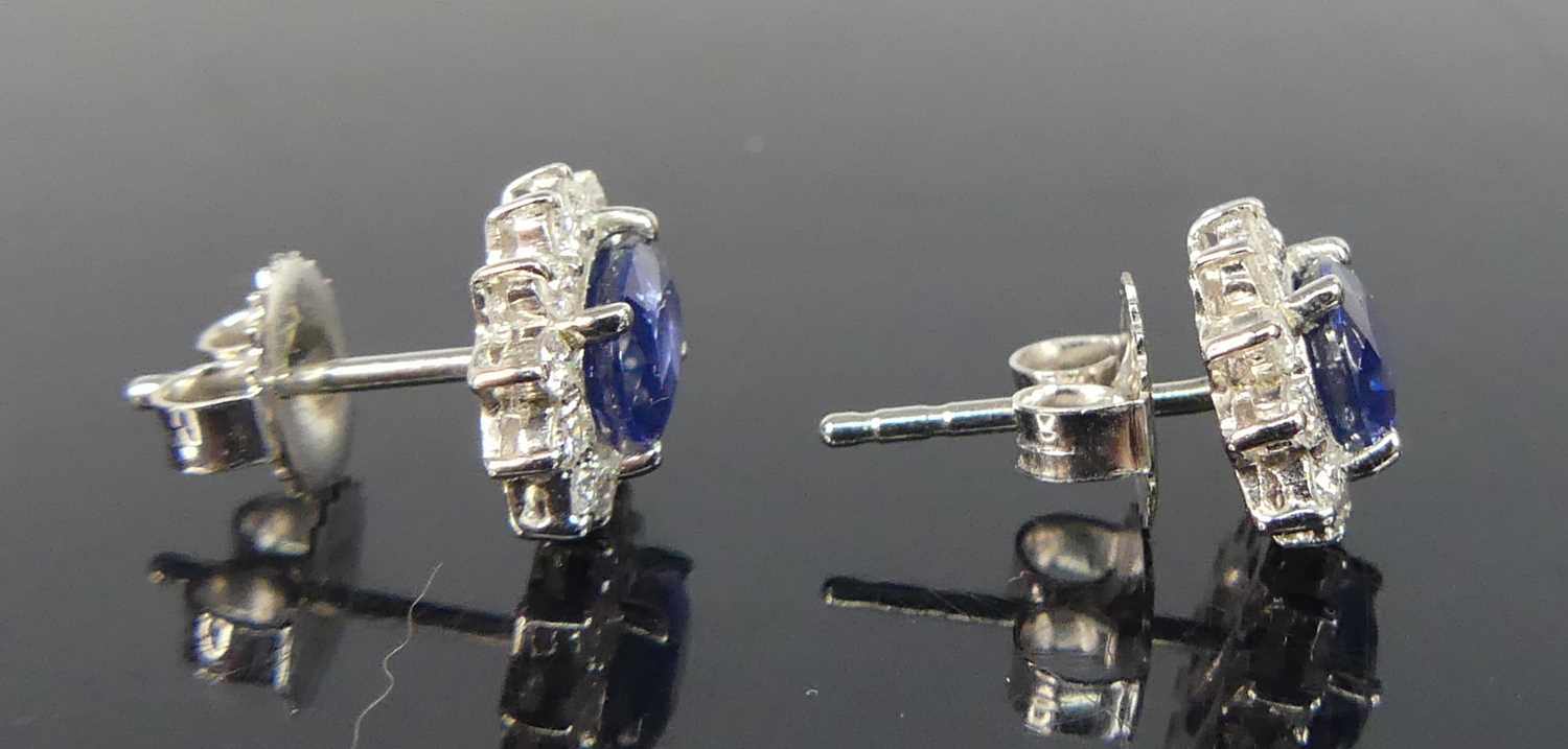 A pair of white metal sapphire and diamond oval cluster earrings, each comprising an oval sapphire - Image 3 of 4