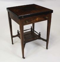 An Edwardian rosewood marquetry inlaid envelope card table, the top with swivel action and baize