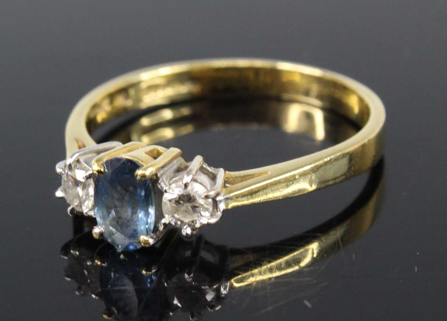 An 18ct yellow and white gold, sapphire and diamond three-stone ring, featuring a centre oval - Image 2 of 4