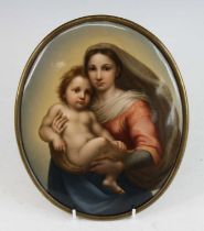 A KPM porcelain oval wall plaque, 19th century, decorated with 'The Sistine Madonna', after Raphael,