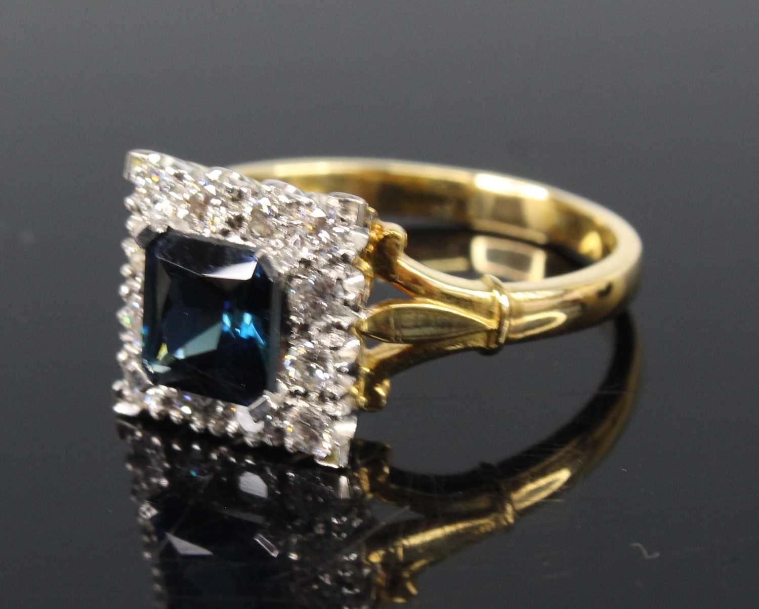 An 18ct yellow and white gold, synthetic sapphire and diamond square cluster ring, featuring a - Image 2 of 3