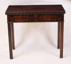 An Edwardian mahogany card table in the Georgian style, the fold-over top with egg and dart