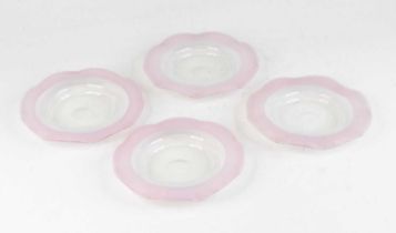 A set of four Stevens and Williams pink and vaseline glass saucers, circa 1880, each having a wavy