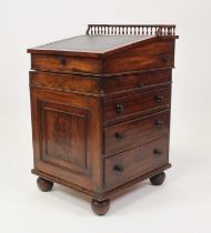 A George IV mahogany campaign type davenport, the sliding top having a spindle turned three-