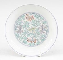 A Chinese porcelain dish, enamel decorated with lotus flowers, apocryphal six character Yongzheng