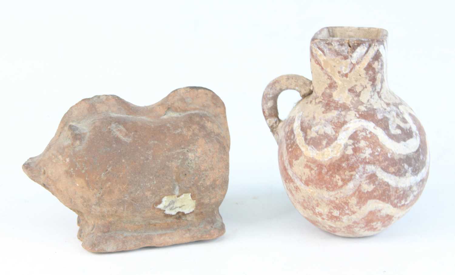 A pottery jug, having a square spout and bulbous body with loop handle and primitive decoration, - Image 2 of 3