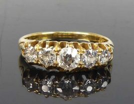 A yellow metal diamond half eternity ring, featuring five graduated Old European cut diamonds in