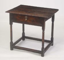 A circa 1700 joined oak side table, having planked top with moulded edge above a single long