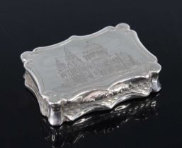 An early Victorian silver vinaigrette, of shaped rectangular form with reeded scrolling borders, the