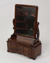 A Victorian mahogany dressing table mirror, having a rectangular plate over a serpentine base fitted