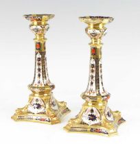 A pair of Royal Crown Derby table candlesticks, 20th century, decorated in the 1128 pattern, first