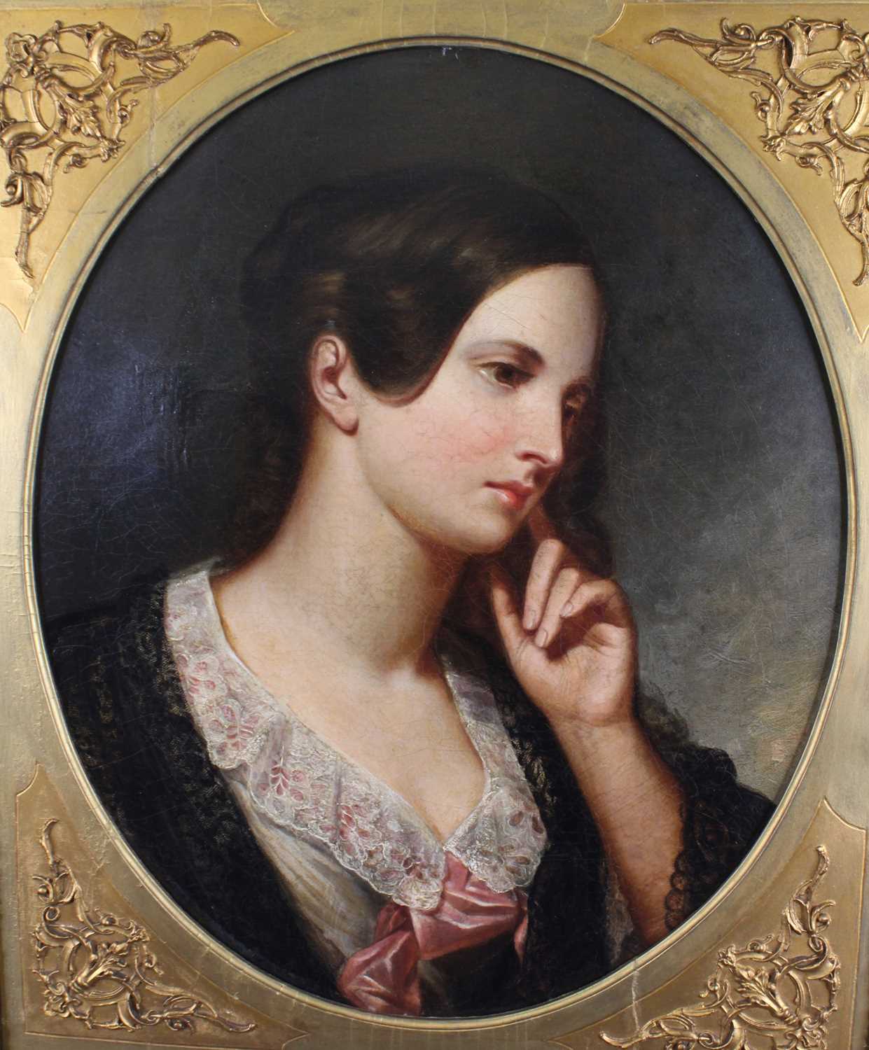 Mid-19th century English school - Bust portrait of a young woman wearing a pink silk scarf, oil on