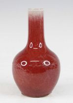 A Chinese sang de bouef bottle vase, the cylindrical neck above a globular body, apocryphal four