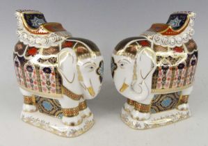 A pair of Royal Crown Derby elephants, each decorated in the Imari palette, heightened in gilt, each