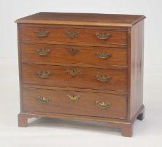 A George III mahogany squarefront chest of four long graduated drawers, each having replacement