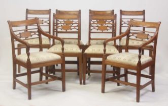 A set of eight 19th century fruitwood dining chairs, each with barbacks, having central satinwood