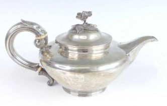 A William IV silver teapot, the body of squat circular form with engraved armorial and goat
