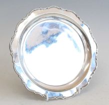 A George IV silver salver, of shaped circular form with a raised reeded rim, maker William