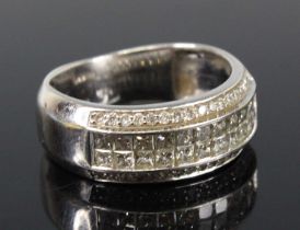A white metal diamond four-row half hoop eternity ring, featuring two rows each with eleven Princess