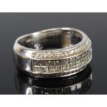 A white metal diamond four-row half hoop eternity ring, featuring two rows each with eleven Princess