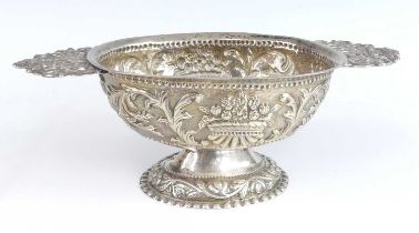 A late 18th century Dutch silver twin handled brandy bowl, of oval form with openwork figural and