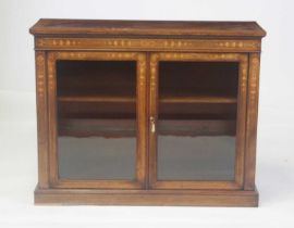 A late Victorian walnut and marquetry inlaid side cabinet, the frieze with floral marquetry banding,