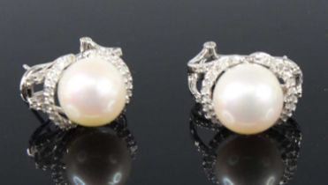 A pair of 9ct white gold, cultured pearl and diamond earrings, each with a 10.35mm cultured pearl
