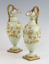 A pair of Grainger's Worcester porcelain ewers, 19th century, each decorated with gilt foliage