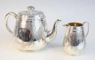 A Victorian silver teapot and matching cream, each of pear shape with C-shaped handles,