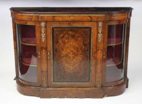 A Victorian figured walnut and inlaid breakfront credenza, having gilt metal mounts and bowed glazed