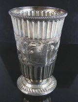 A Victorian silver chalice, of tapered form to a spreading foot, the whole having repousse fluted