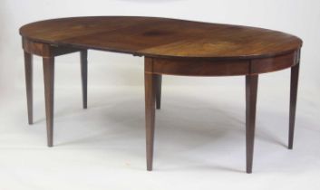 A George III mahogany double D-end dining table, the top having a single leaf, satinwood crossbanded