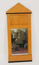 A Biedermeier birds-eye maple veneered wall mirror, of architectural outline, 121 x 51cm